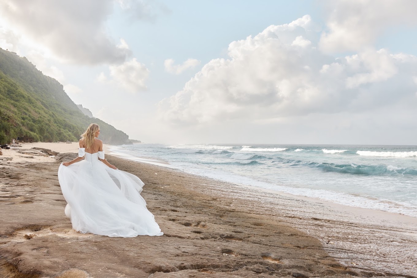 Bride wearing a Madi Lane gown on the beach